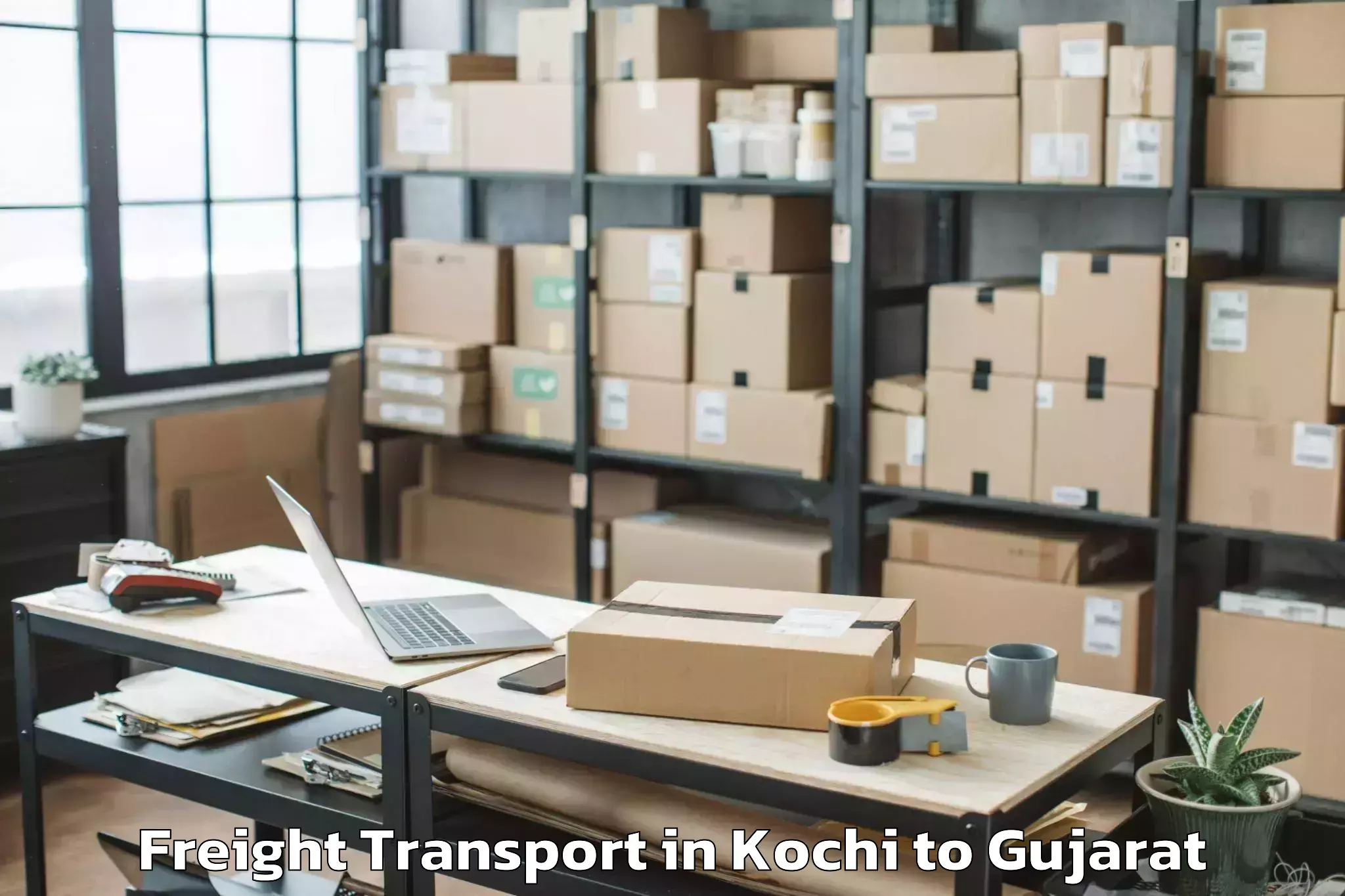 Discover Kochi to Veer Narmad South Gujarat Univ Freight Transport